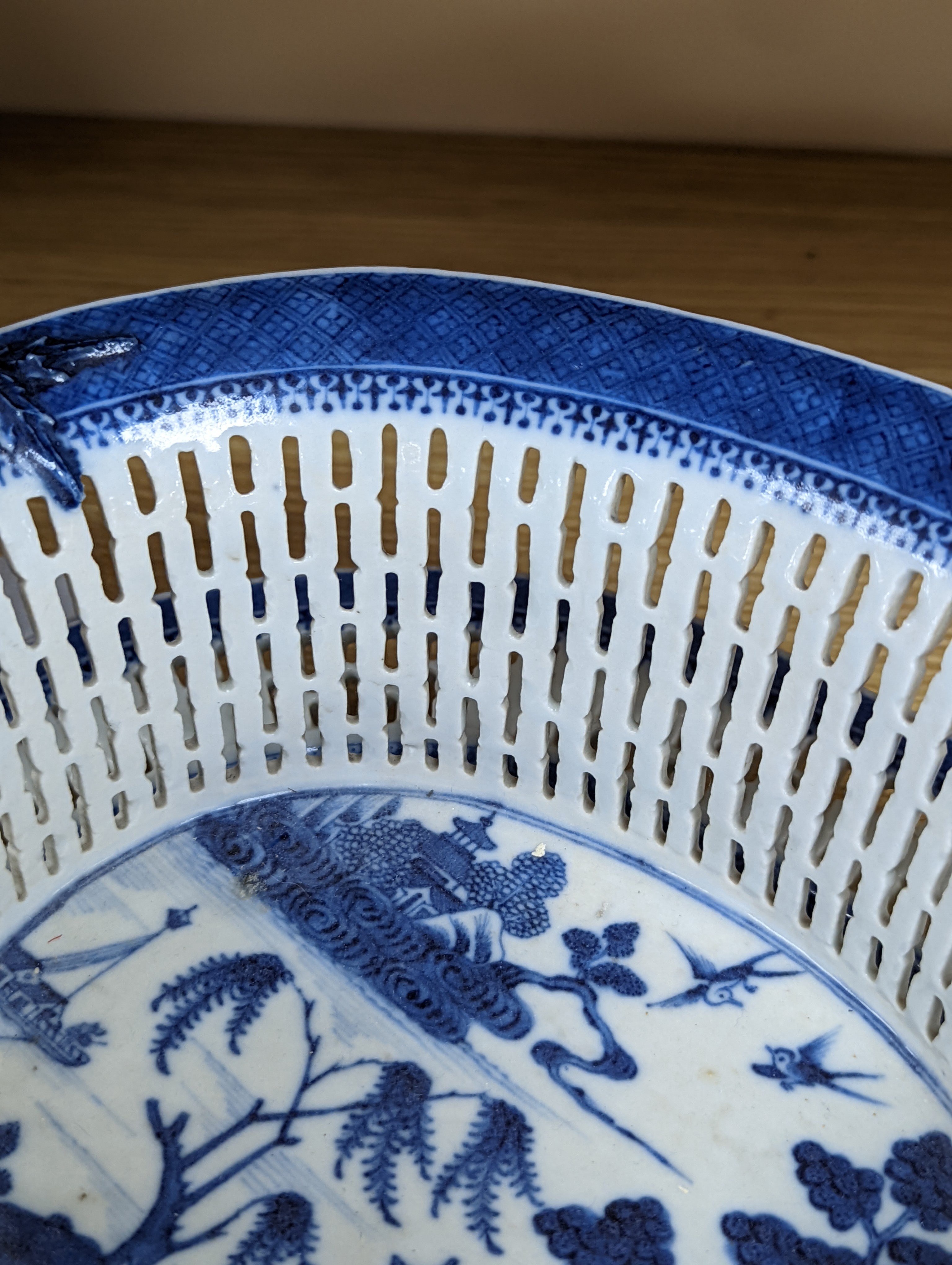 A Chinese blue and white chestnut basket and stand, Qianlong period, basket 11 cms high.